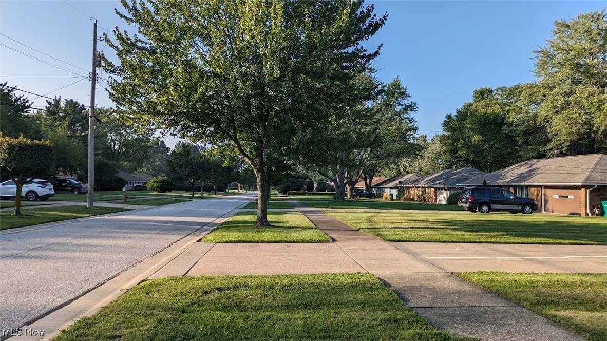 View of asphalt road with sidewalks