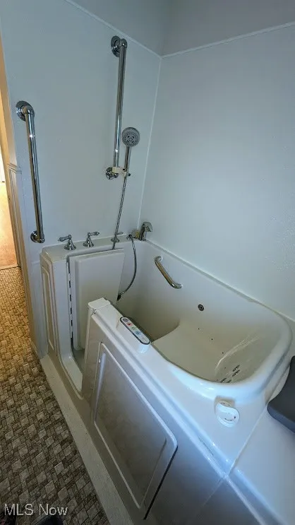 Bathroom with a jetted tub