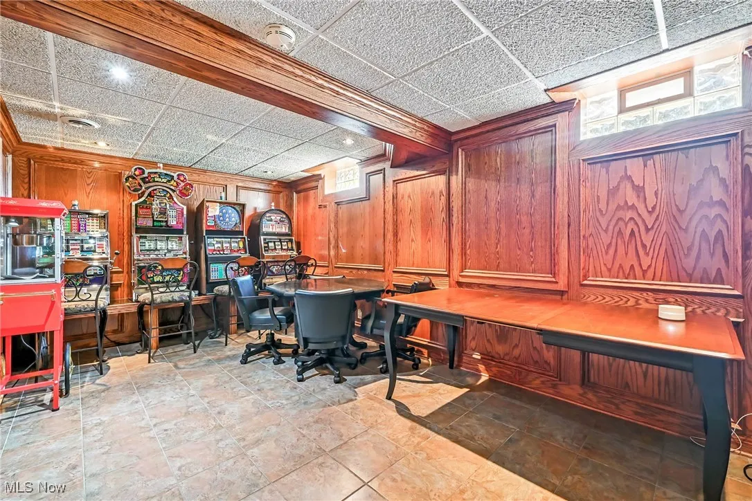 Home office with wood walls