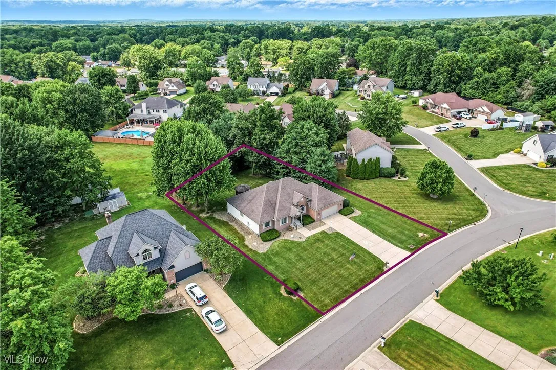 Aerial perspective of suburban area with property parcel outlined