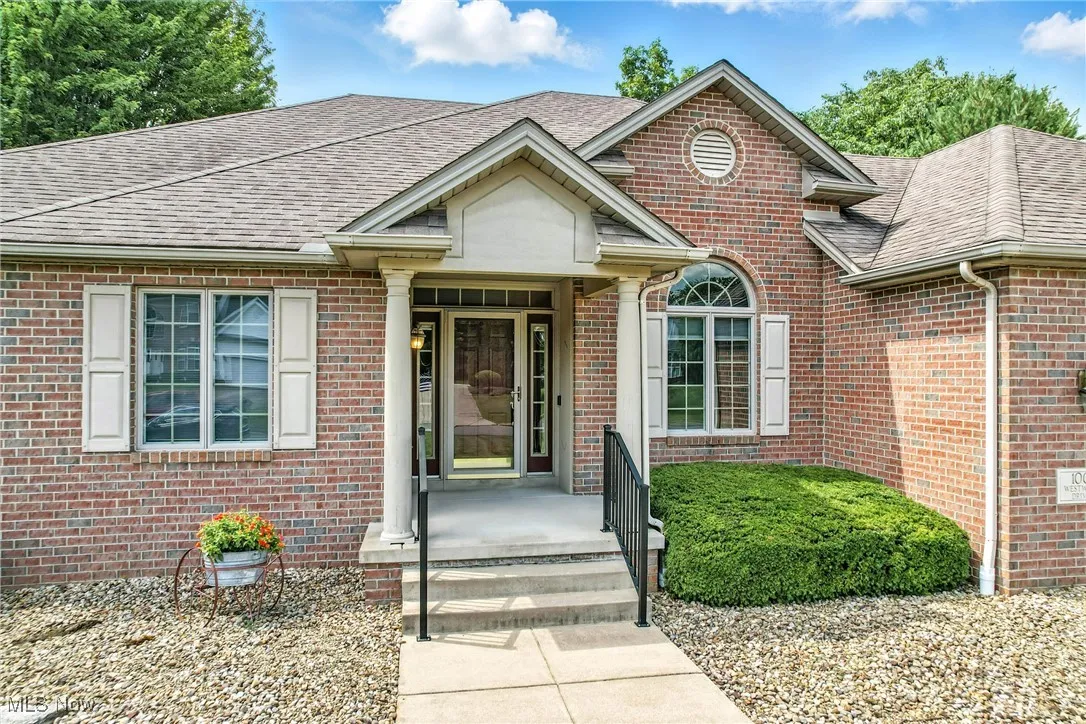 View of front of house featuring brick siding