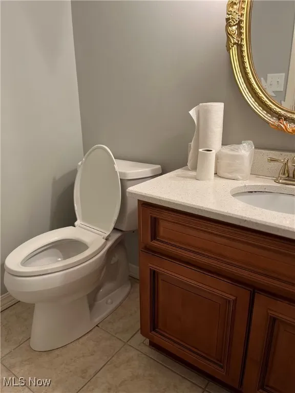 Bathroom featuring vanity and tile patterned flooring
