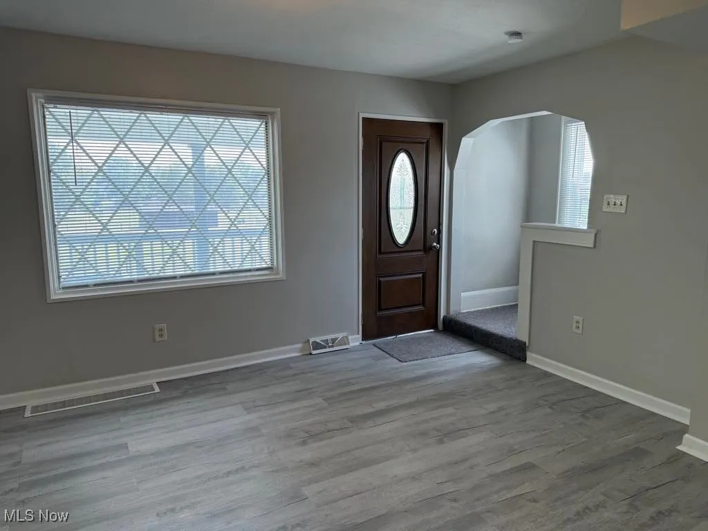 Foyer entrance with arched walkways