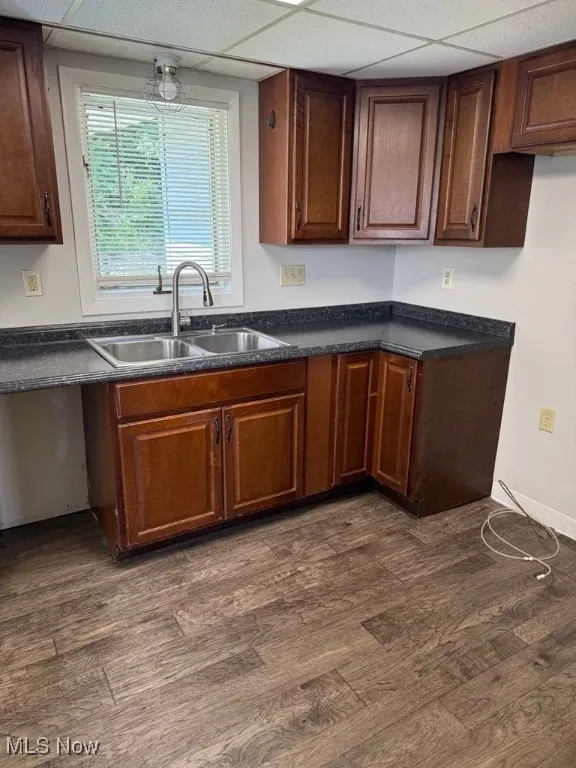 Kitchen featuring dark countertops