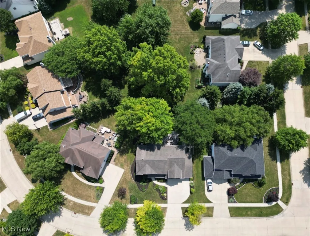 Aerial view of property's location with nearby suburban area