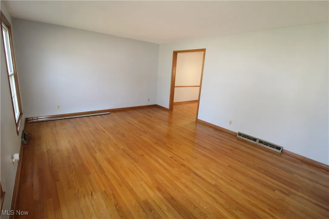 Living room leads to Dining room.