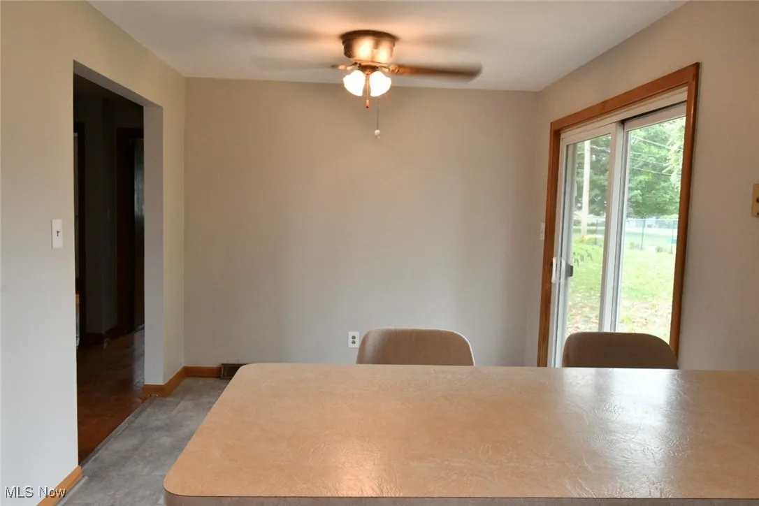 Dining room with a ceiling fan