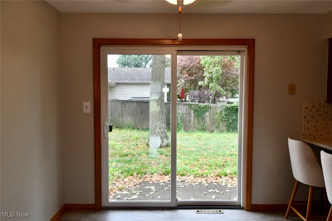 Doorway to outside with baseboards