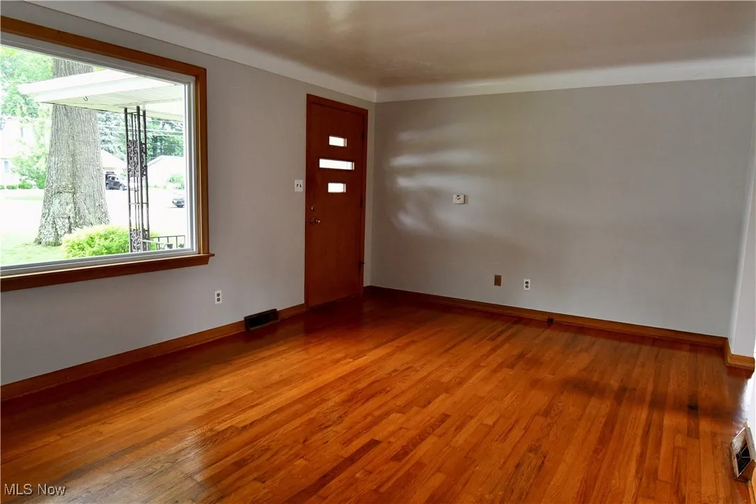 Entryway featuring wood finished floors and baseboards