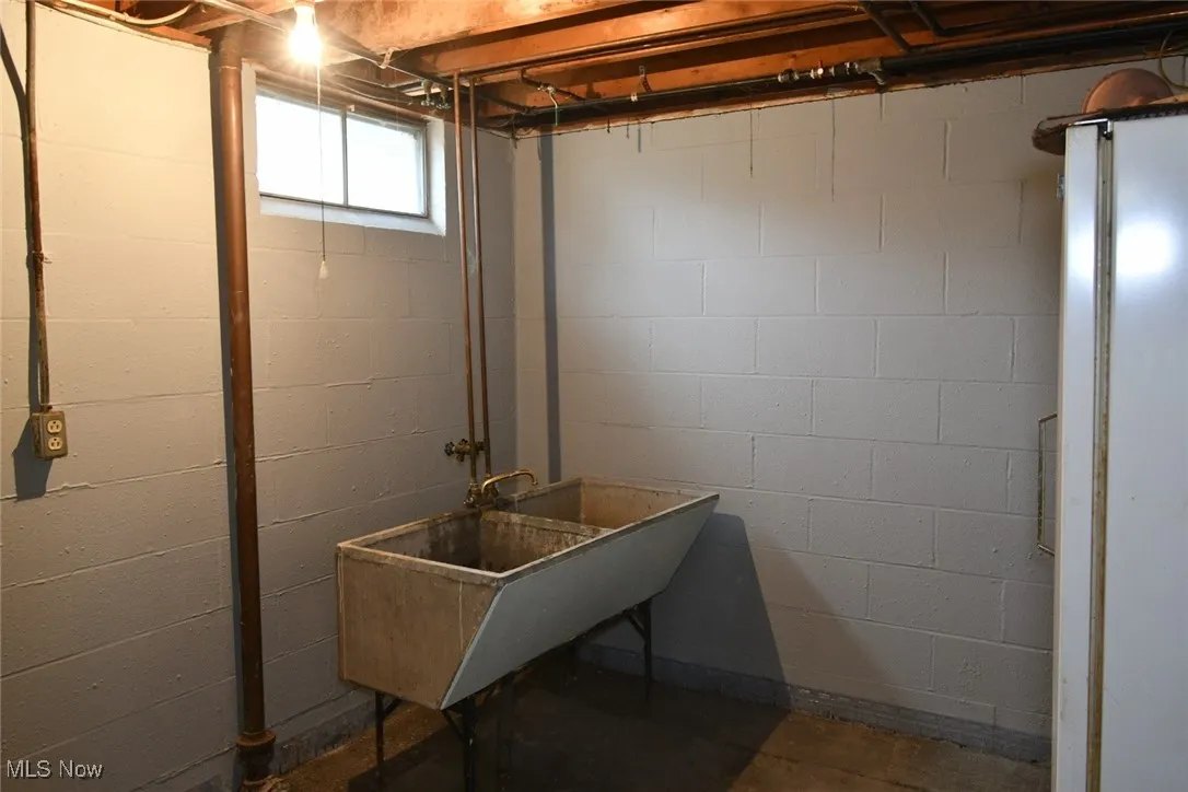 Below grade area with a sink