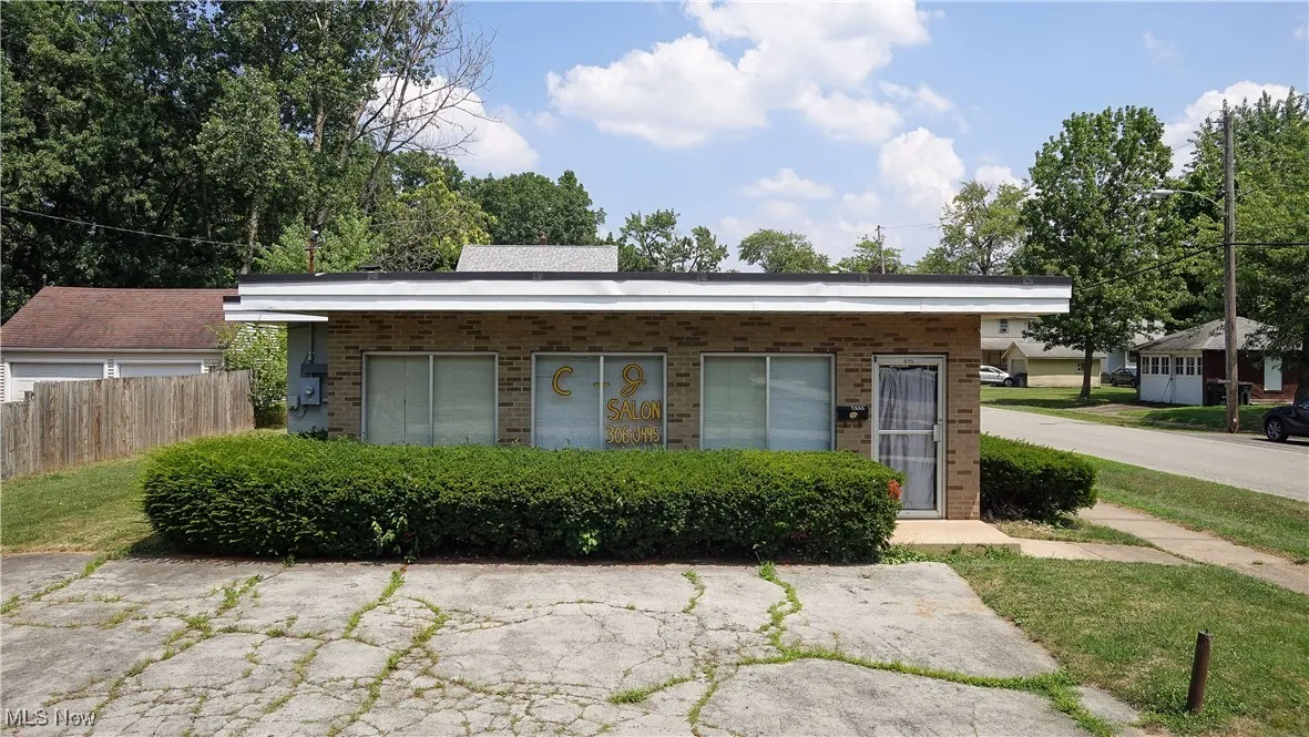 View of front of home featuring brick siding