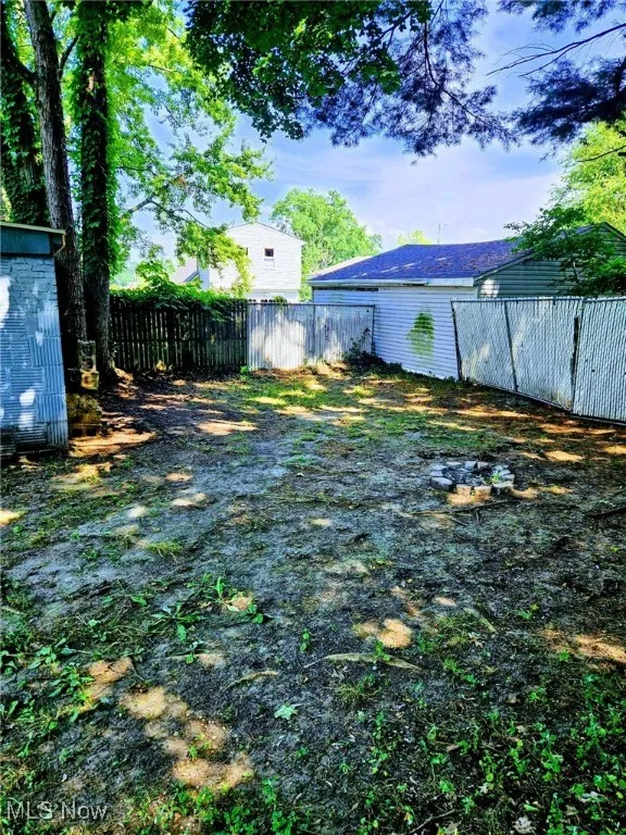 View of yard featuring a garage
