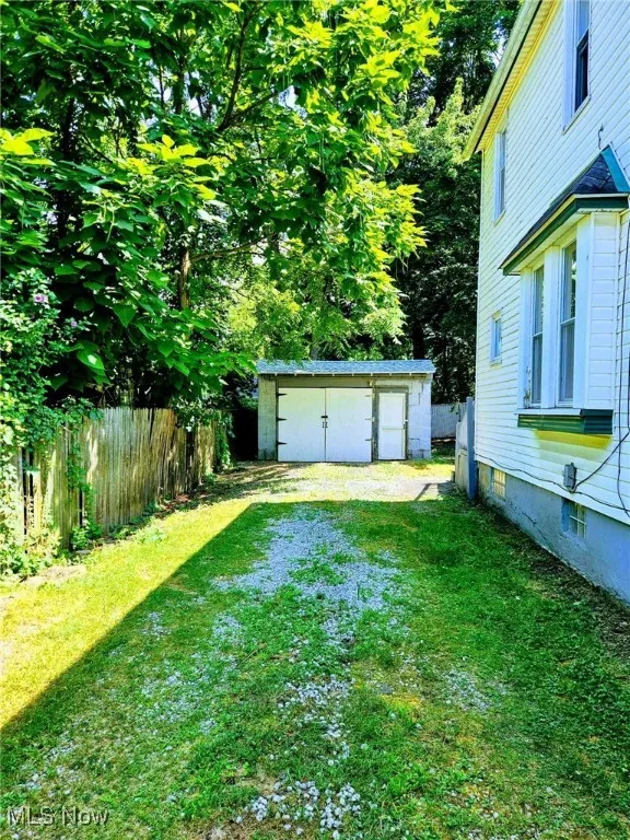 View of yard featuring a garage