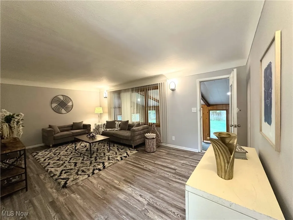 Living area featuring wood finished floors and baseboards
