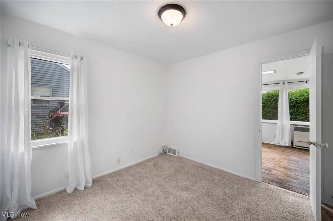 Carpeted bedroom with baseboards