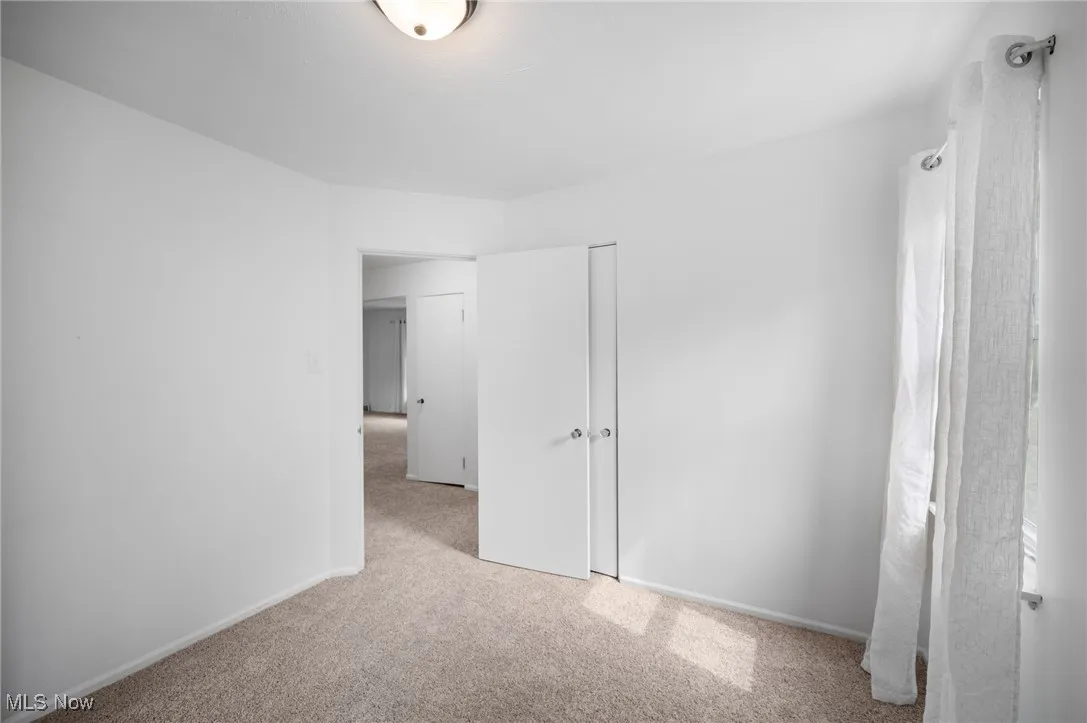 Unfurnished bedroom with carpet floors and a closet