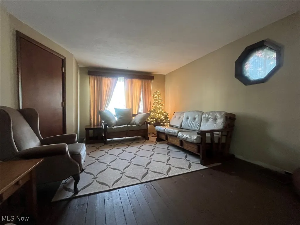 Living room with hardwood / wood-style floors