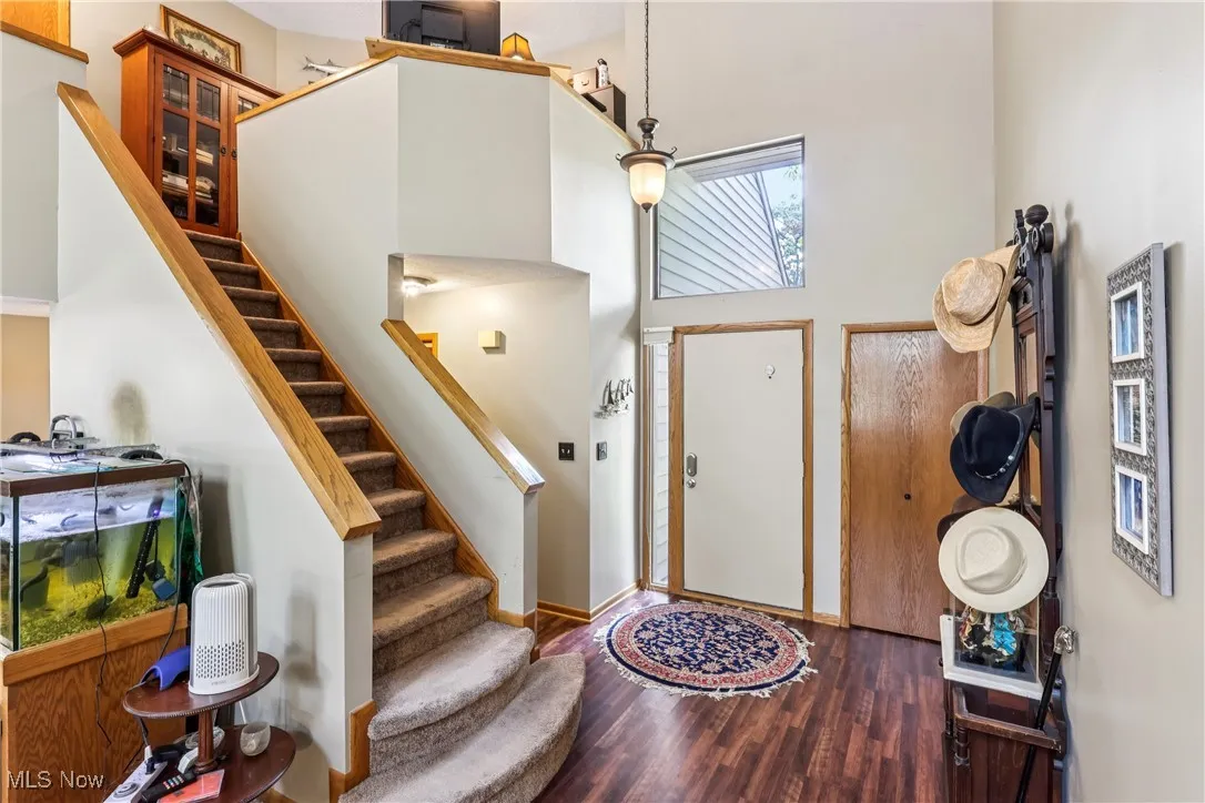 Foyer featuring a high ceiling  and stairs