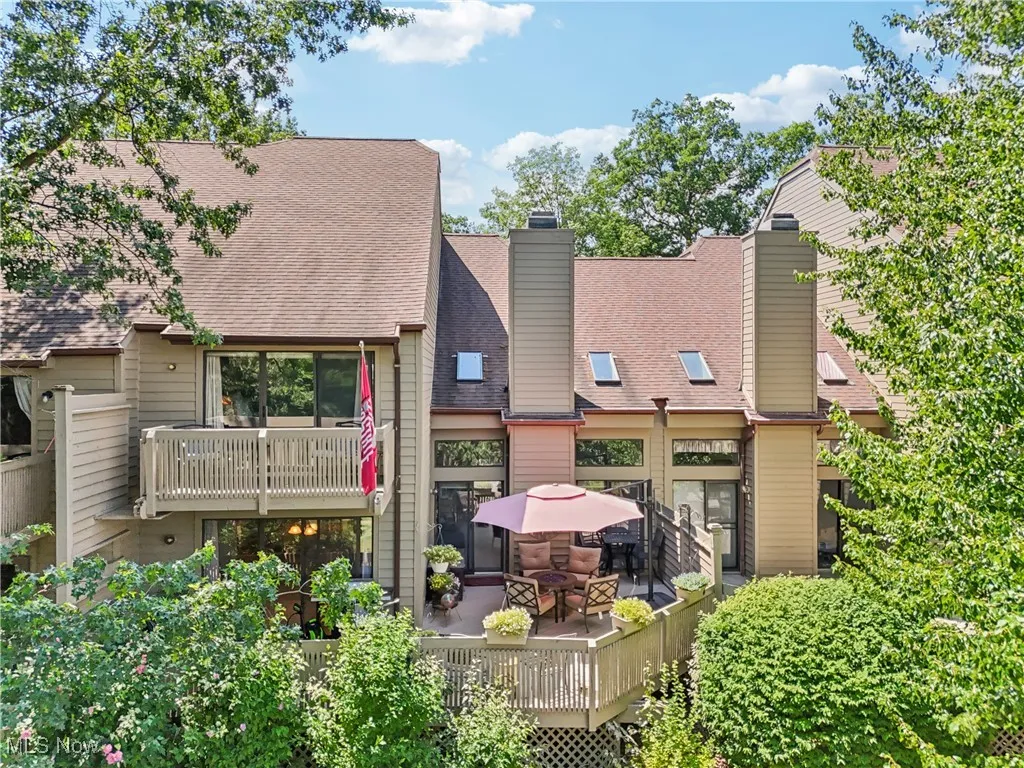 Back of the property showing both the balcony and large deck
