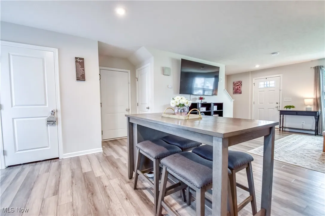 Dining room featuring light wood-type flooring and recessed lighting