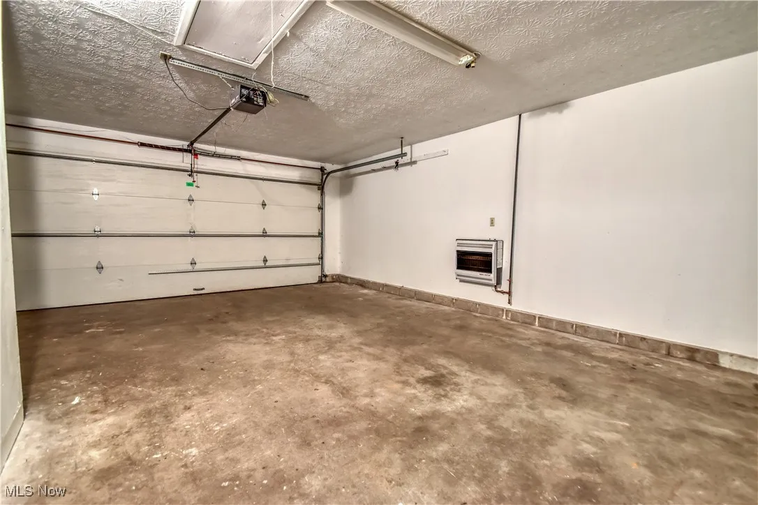 Garage with heating unit and a garage door opener