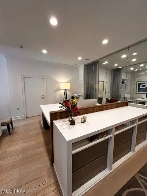Office featuring built in filing system and bookshelves
