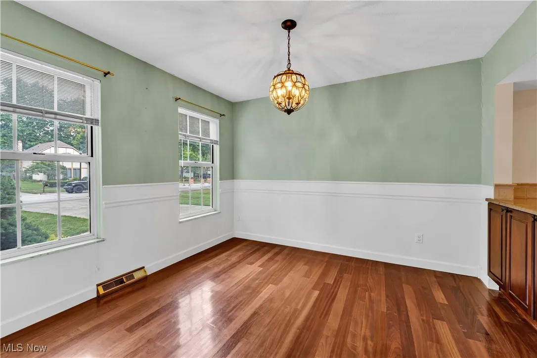 DINING ROOM FOR SPECIAL GATHERINGS OR FAMILY MEALS....CUSTOM BUILT IN CABINETS PROVIDE EXTRA STORAGE SPACE WITH CONVENIENT PASS THRU COUNTER FROM KITCHEN
