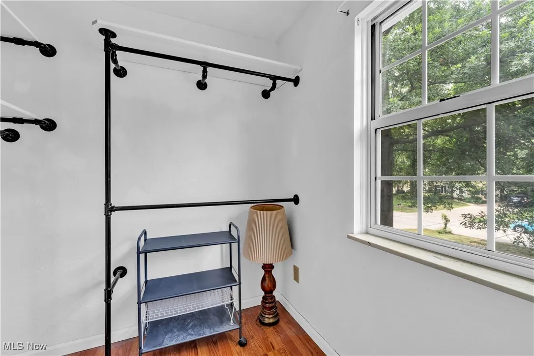 PRIMARY BEDROOM WALK IN CLOSET - YOU'LL FIND FULL WALK UP ATTIC STAIRS FOR CONVENIENT ACCESSIBILITY FOR STORAGE