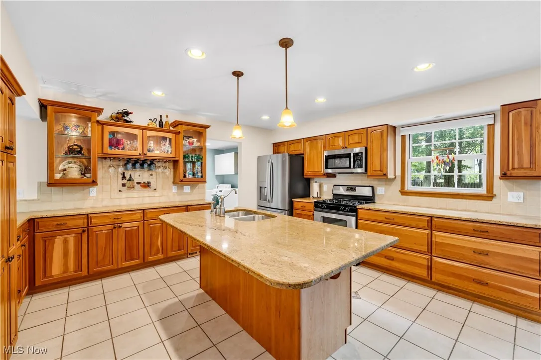 READY FOR A NEW CHEF!!!  OPEN AND SPACIOUS CUSTOM CLASSIC UPDATED WTH GRANITE COUNTERS, TONS OF CABINETS AND OVERSIZED DRAWERS, TILED BACKSPLASH AND  OVERSIZED CENTER ISLAND