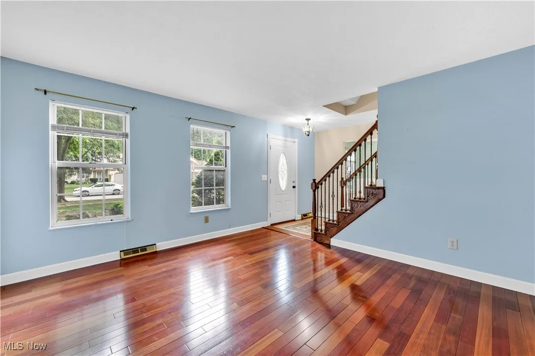 LOTS OF NATURAL LIGHT - THE BEAUTIFUL FLOORING BRINGS DURABILITY AND TIMELESS BEAUTY.