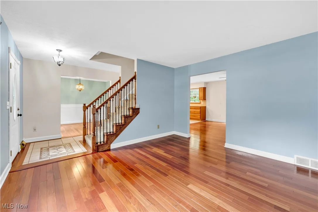 CENTER HALL COLONIAL... FORMAL LIVING ROOM WITH CUSTOM BRAZILIAN HARDWOOD FLOORING.