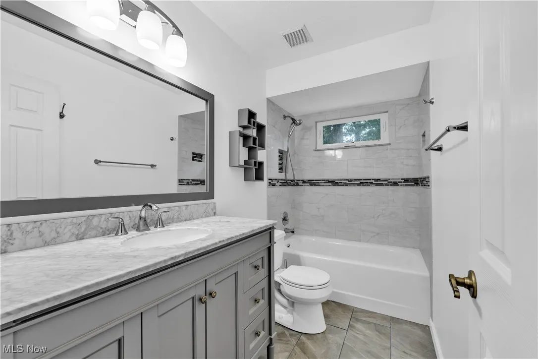 SECOND FLOOR FULL BATHROOM RECENTLY UPDATED WITH MODERN TILES AND FIXTURES