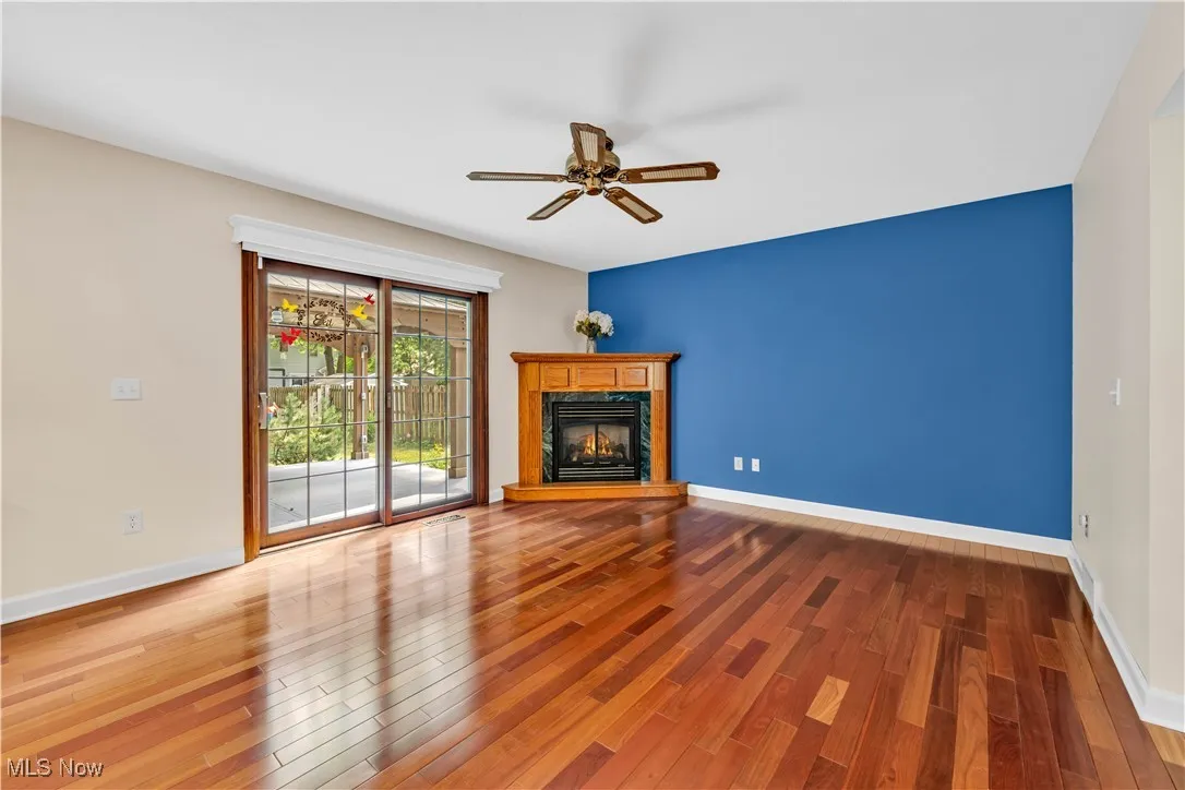 FAMILY ROOM WITH CUSTOM BRAZILIAN DURABLE FLOORING - COUNTER GAS FIREPLACE - PATIO ACCESS TO OUTSIDE DECK AND NATURE VIEWS
