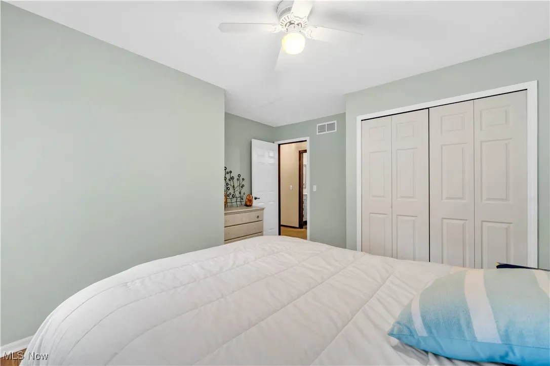 BEDROOM FEATURES LARGE CLOSET AND CEILING FAN/LIGHT