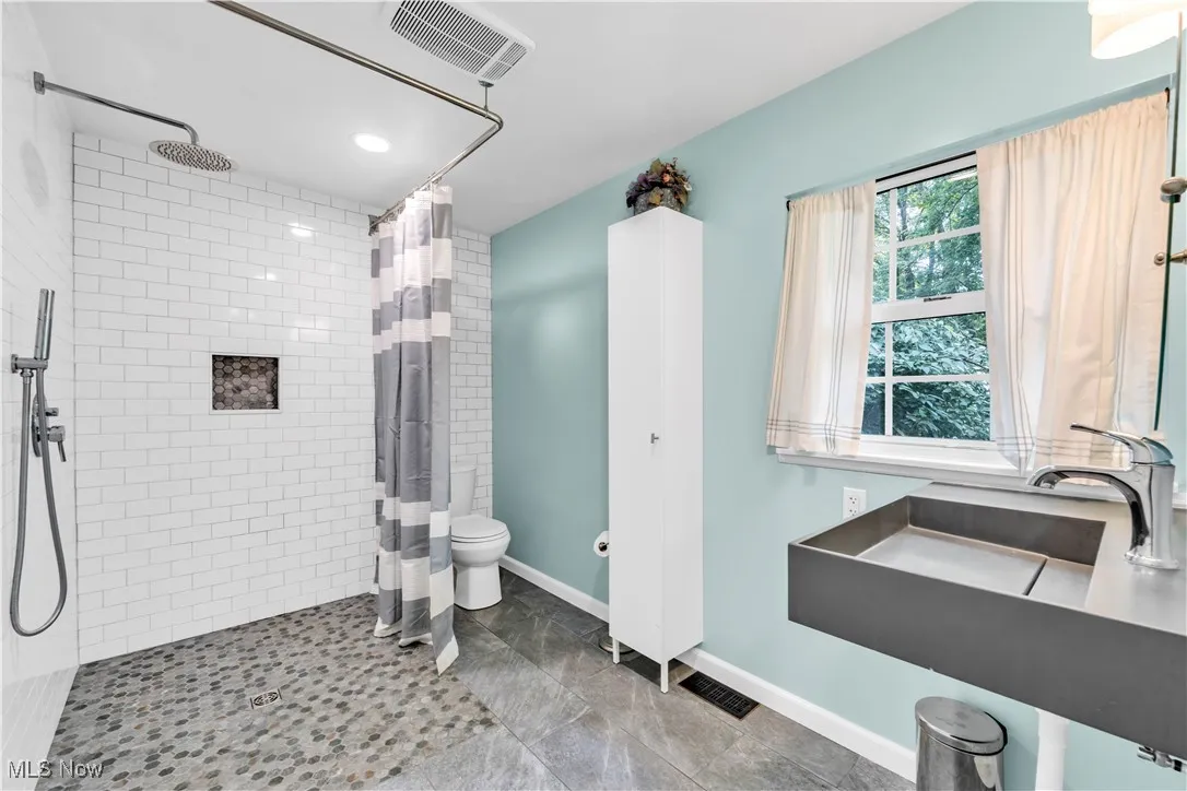 OVERSIZED FULL BATHROOM WITH SHOWER - NEWLY UPDATED WITH TILE FLOORING AND SHOWER TILE - FULL ACCESSIBILITY