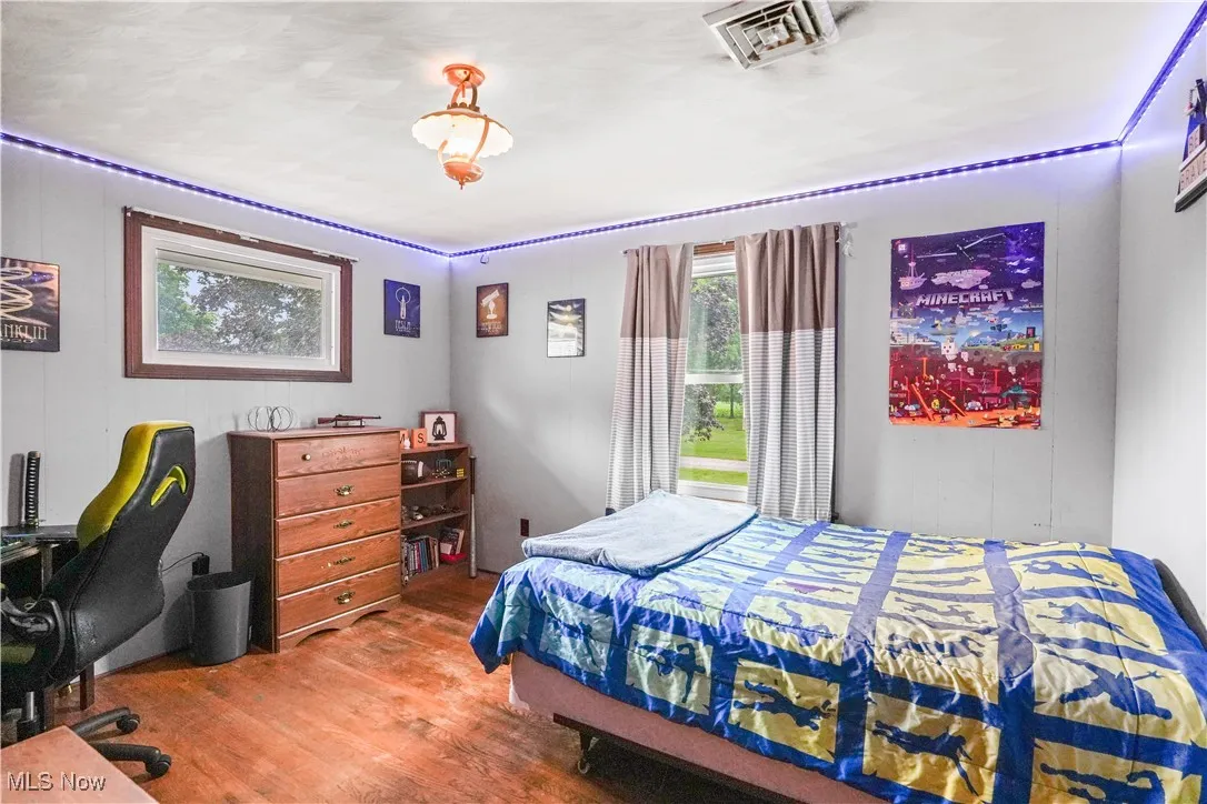 Bedroom featuring wood finished floors