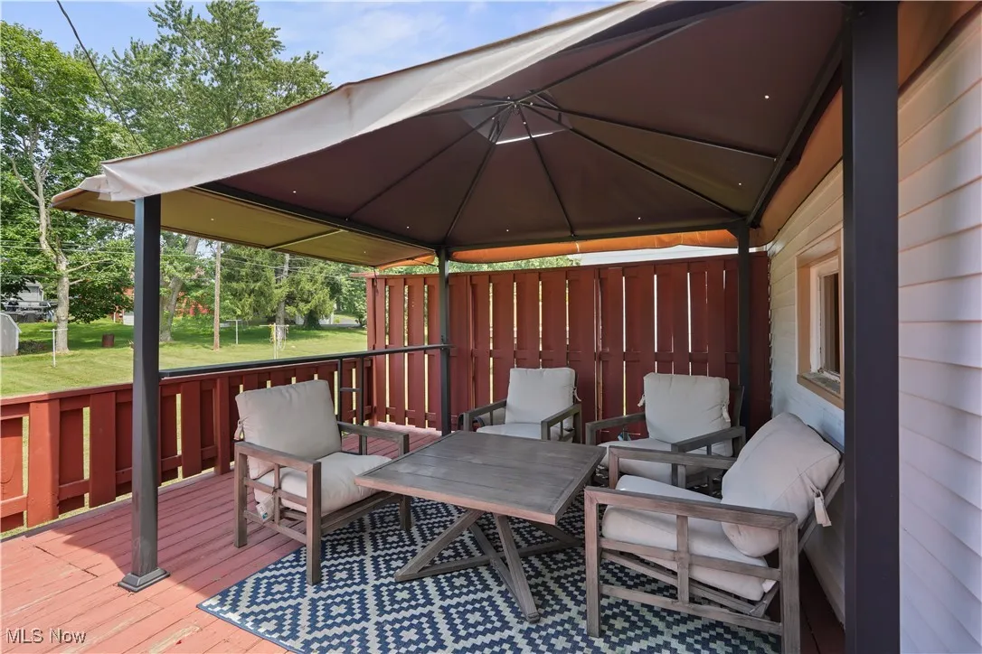Wooden deck featuring a gazebo