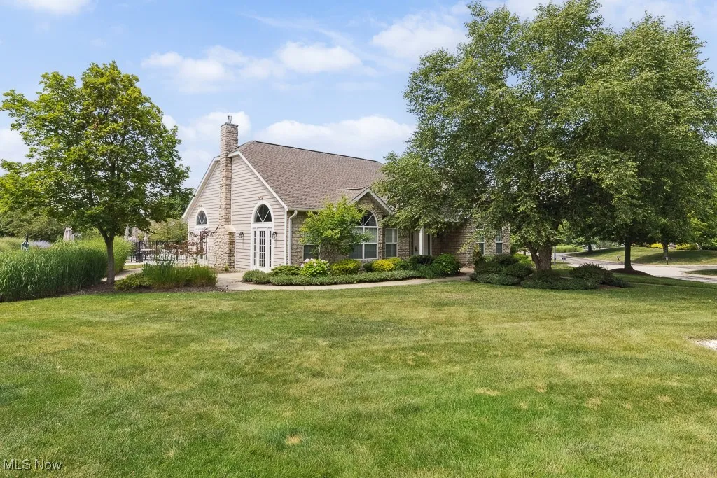 View of front of home featuring a front yard and a chimney