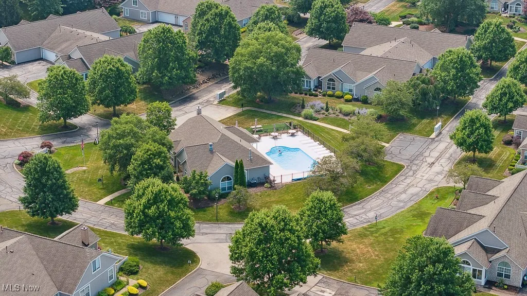 Aerial perspective of suburban area with a pool