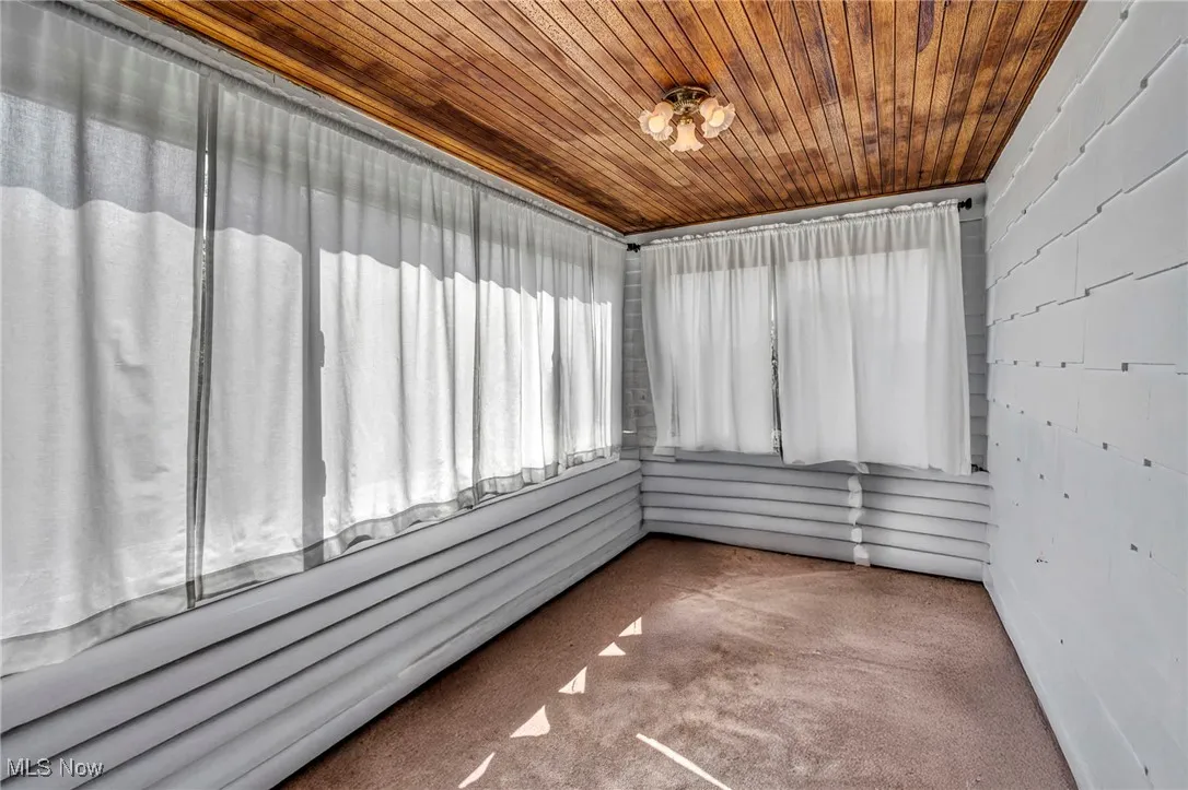 Unfurnished sunroom with a sauna / steam room