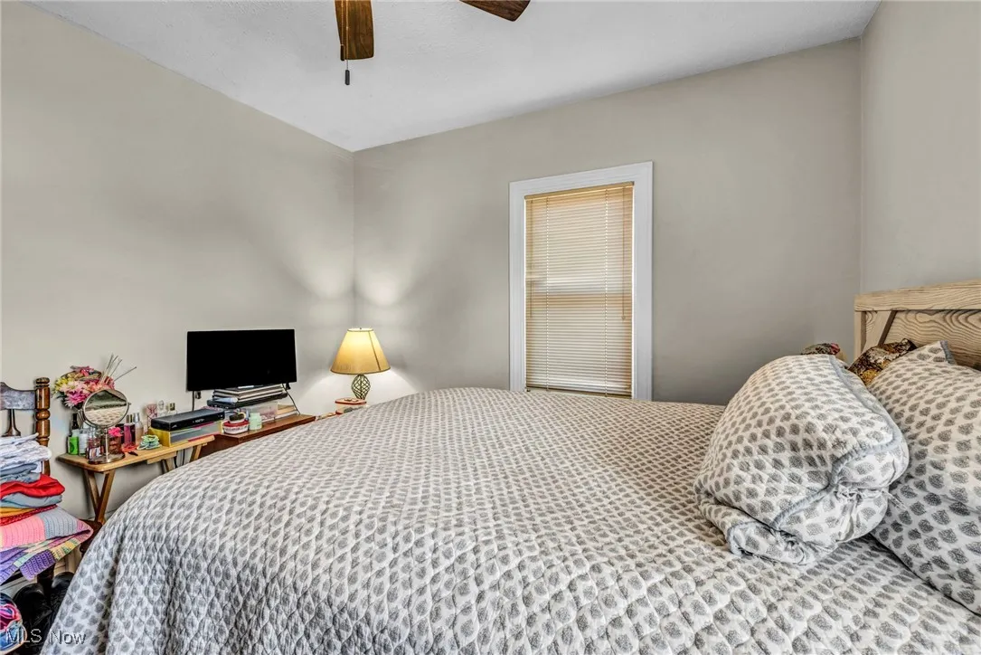 Bedroom featuring a ceiling fan