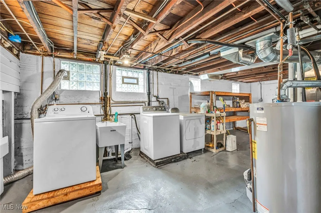 Below grade area with independent washer and dryer and water heater