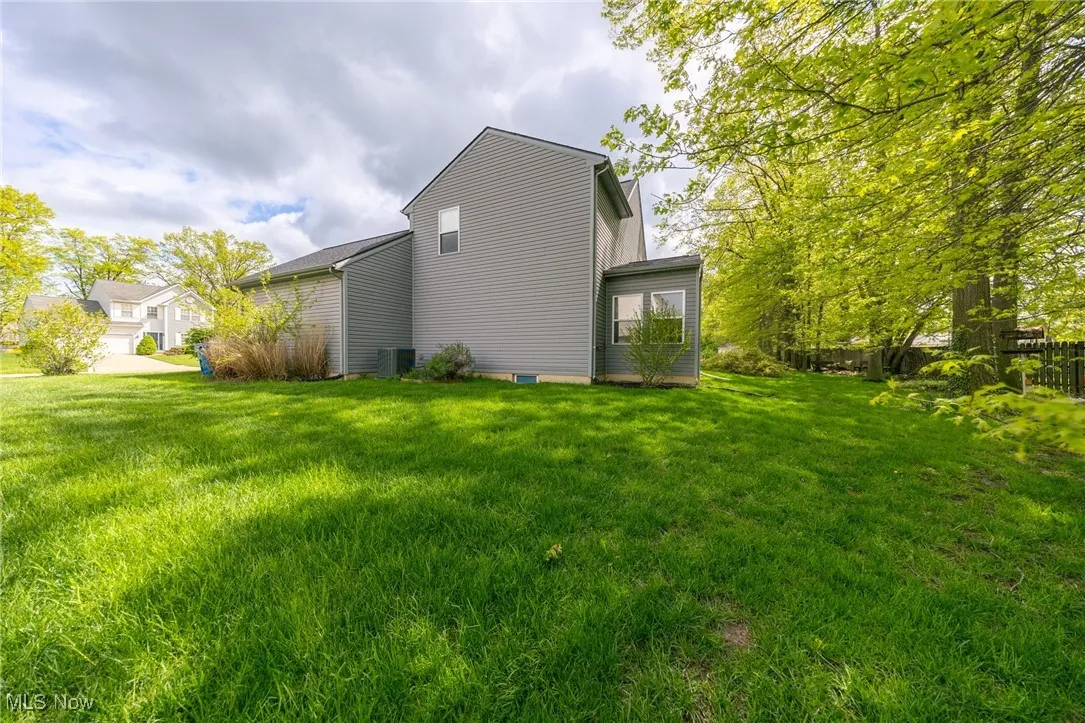 Back of house featuring a yard