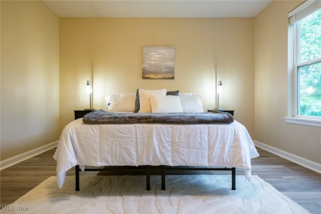 Bedroom with wood finished floors