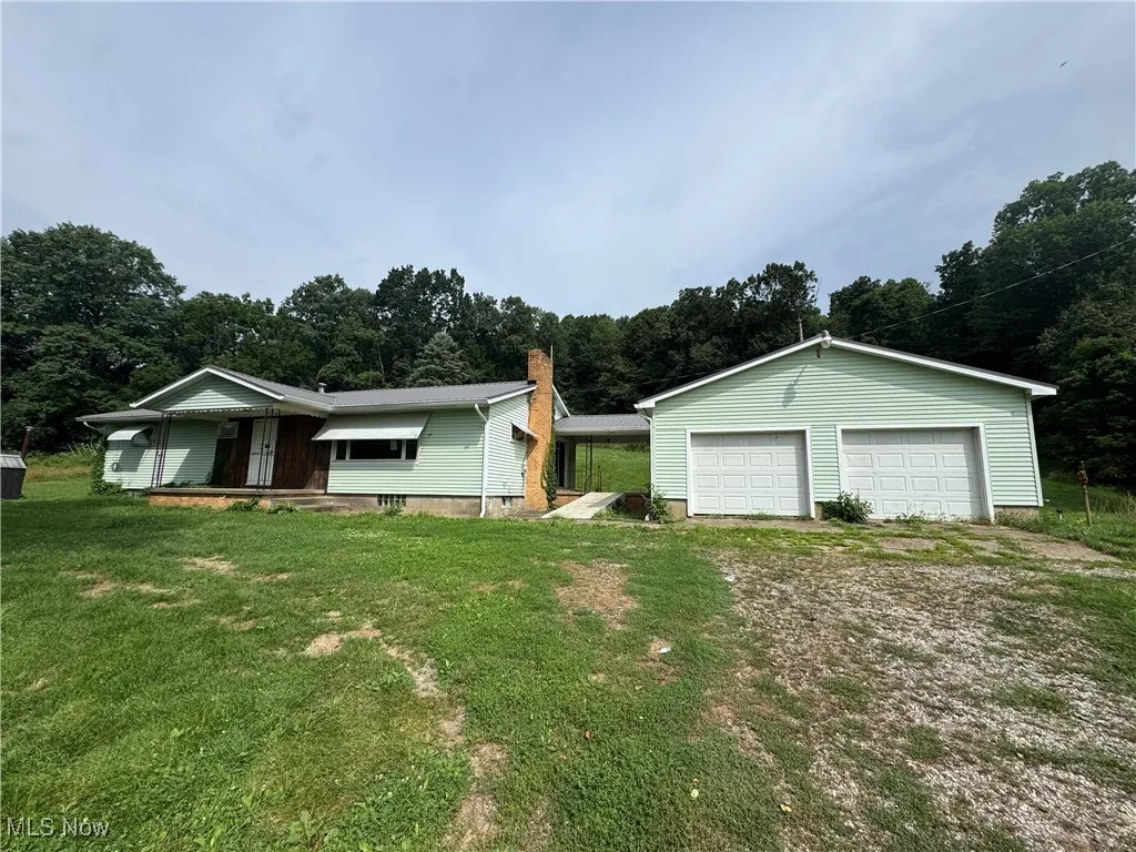 View of front of home with 2 car garage