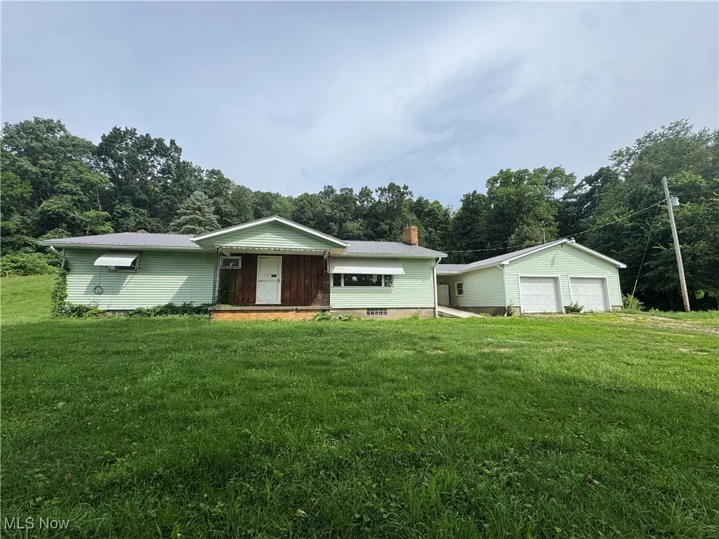 View of front of home with 2 car garage