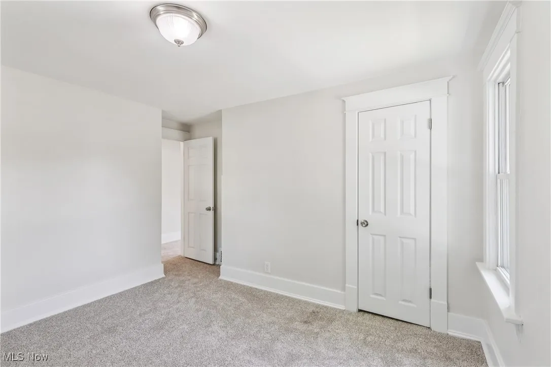 Bedroom with a closet and carpet flooring