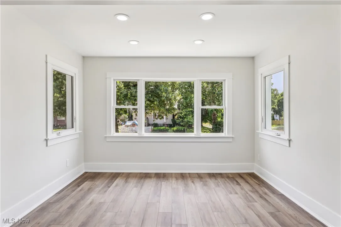 Living room with large picture window and LVT flooring