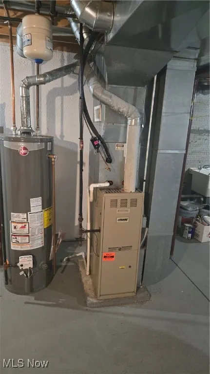 Utility room with water heater and heating unit