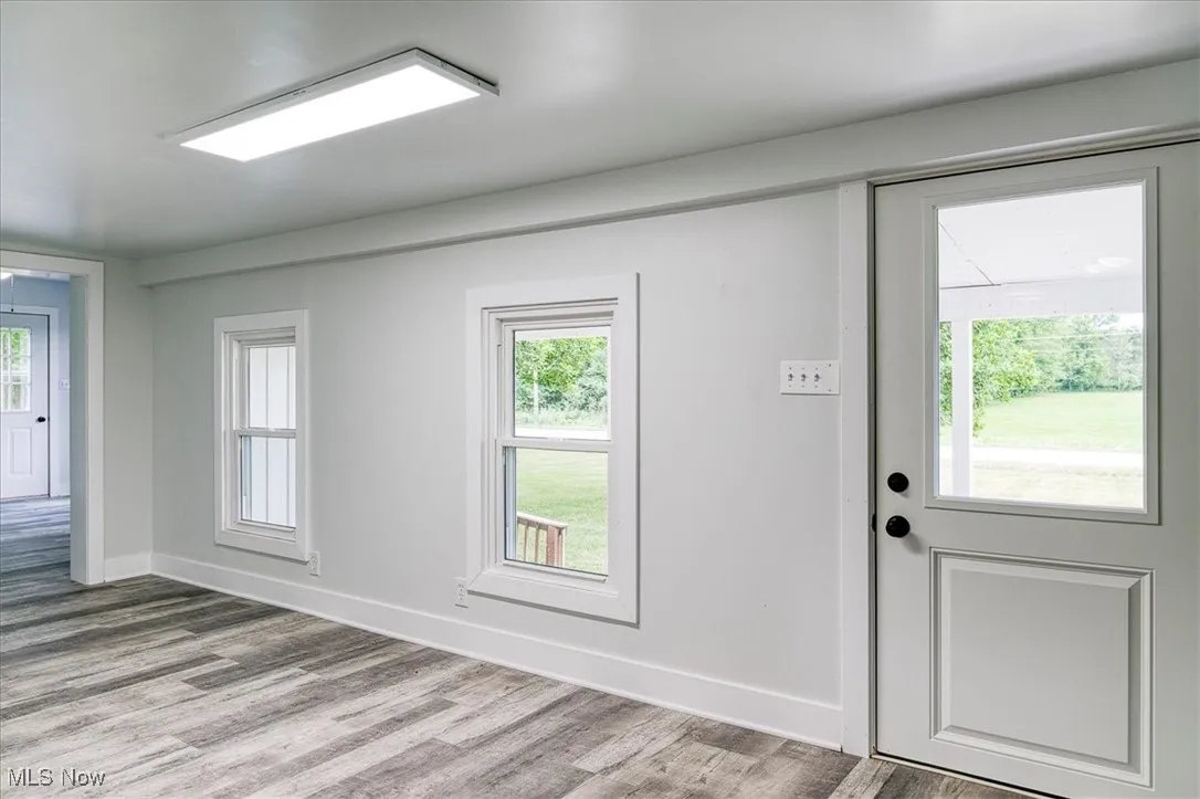 Foyer entrance featuring wood finished floors and plenty of natural light